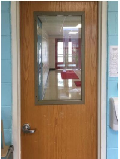 A door with a mirror on the side of it.
